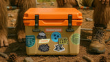 Bigfoot vinyl sticker and other Chattanooga-themed stickers on a weathered cooler — waterproof, outdoor-ready decals for adventurers.