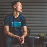 Model drinking coffee at the Camp House while wearing the NativeMade Chattanooga Fade Tee